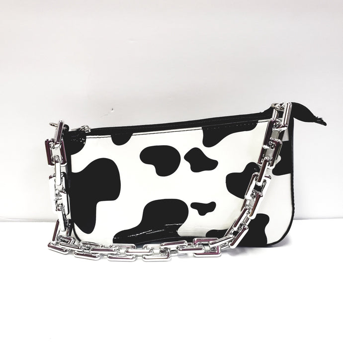 My Accessories London slouchy cross body bag in cow print faux fur | ASOS